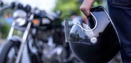motorcycle driver holding a helmet (1)
