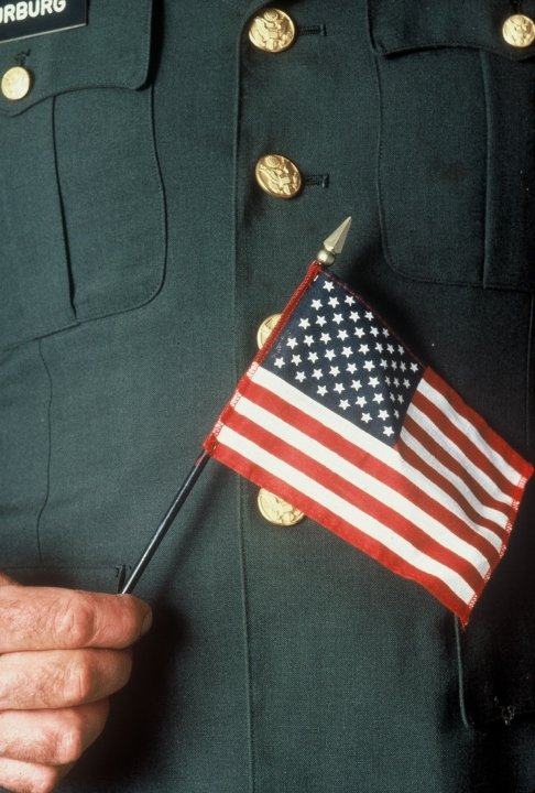 veteran holiding the United States Flag