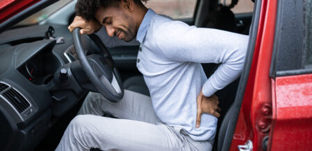 A man with lower back pain after a crash