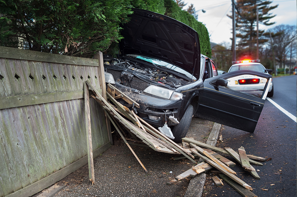 car crashed into fence