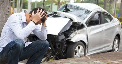 person upset at scene of car accident