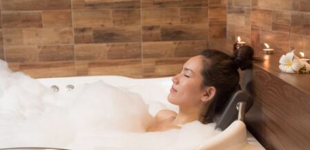 female laying in the bathtub