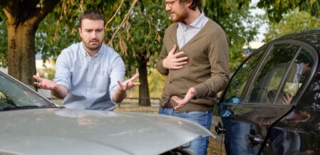 drivers arguing over car accident outside