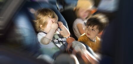 baby crying in an infant car seat