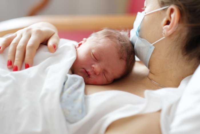 mother holding baby after birth as many mothers are unable to do due to complication