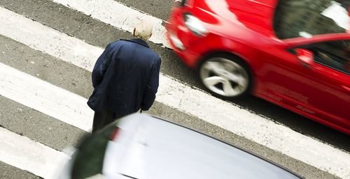 man on pedestrian crossing road