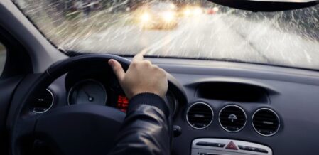 man driving in bad weather