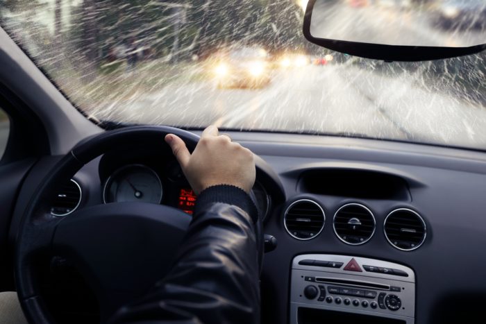 man driving in bad weather