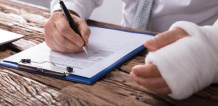 injured worker filling out workers comp claim paperwork in South Carolina