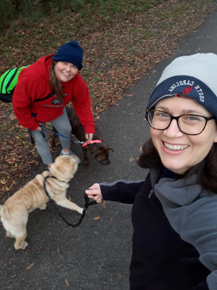 Sam and Marcy of the Charleston office spent time outside walking their dogs together.