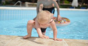 child playing at the swimming pool