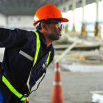 warehouse worker with back injuries as a result of repetitive motion