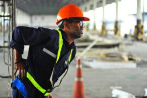warehouse worker with back injuries as a result of repetitive motion