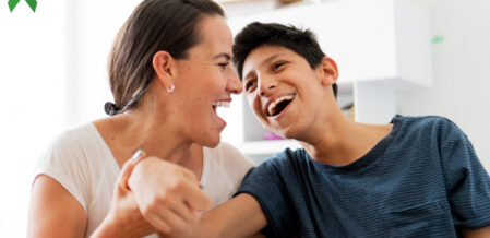A mom and her son laughing