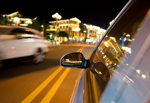 car speeding on the road