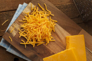 grated cheddar cheese on a table
