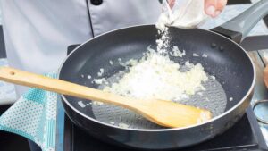 stirring butter with flour and diced onions