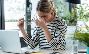 Stressed mature business woman looking worried
