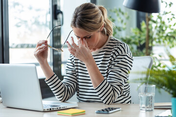 Stressed mature business woman looking worried