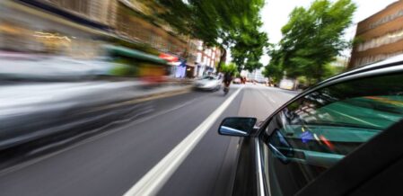 car speeding on the road
