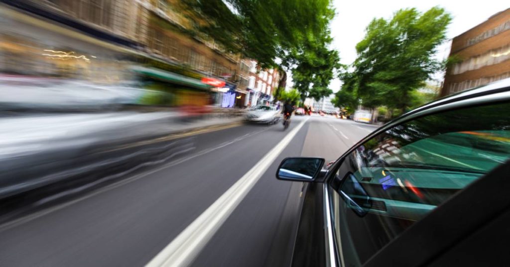 car speeding on the road