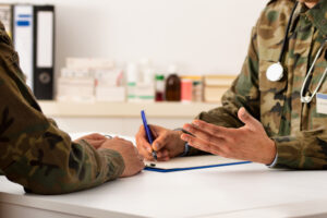 Cropped shot of a army doctor a giving his patient advice during a consult