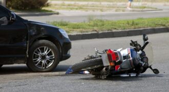 Motorcycle on its side after being in an accident