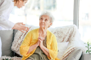 an elderly woman is emotionally abuse by a female caregiver