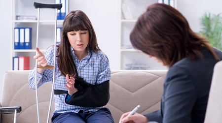 woman speaking with attorney