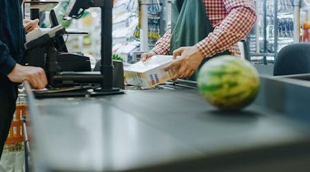 grocery store employee working