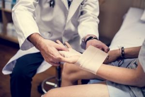 Doctor helping a patient