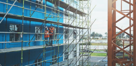 people standing on scaffolding