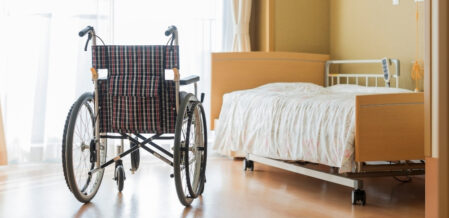 a wheelchair next to a bed
