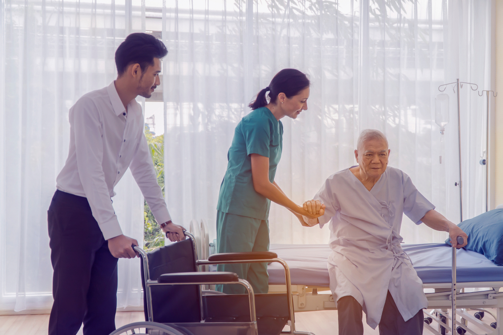 Doctor holding patient's hand, Senior man