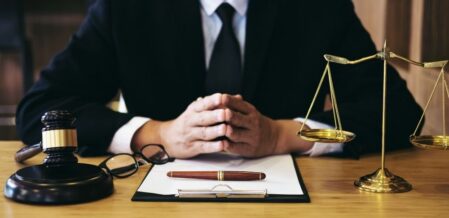 a lawyer sitting behind a desk