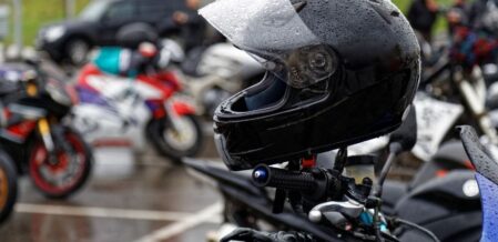 Image of a motorcycle in rainy parking lot