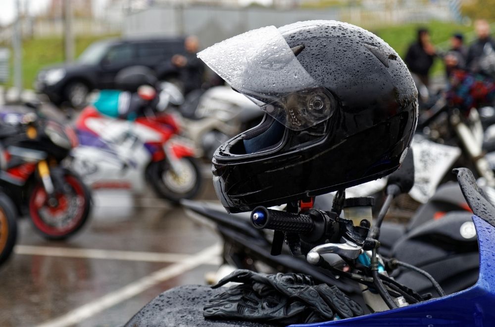 Image of a motorcycle in rainy parking lot