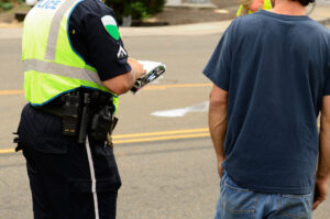 Police writing a citation at a vehicle accident