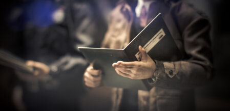 an investigator is reviewing files and documents