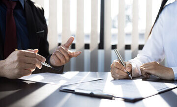 customer are signing an insurance agreement with their insurance company