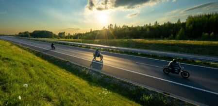 3 motorcycles on an open road