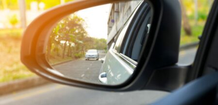 a car in the side mirror