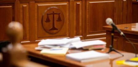 South Carolina statute of limitations. Court room with scales of justice on wall.