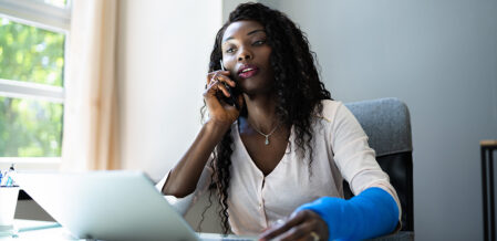 Woman in a cast on the phone