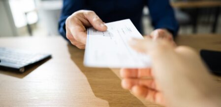 people exchanging a check