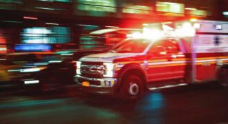 Motion blur ambulance attending pedestrian injury in Clemson, SC