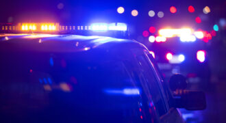 Police cruiser lights at the scene of a fatal accident involving a pedestrian in Charleston, SC