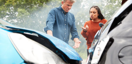 Image of two people arguing after a car collision