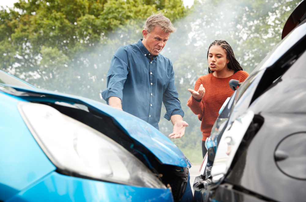 Image of two people arguing after a car collision