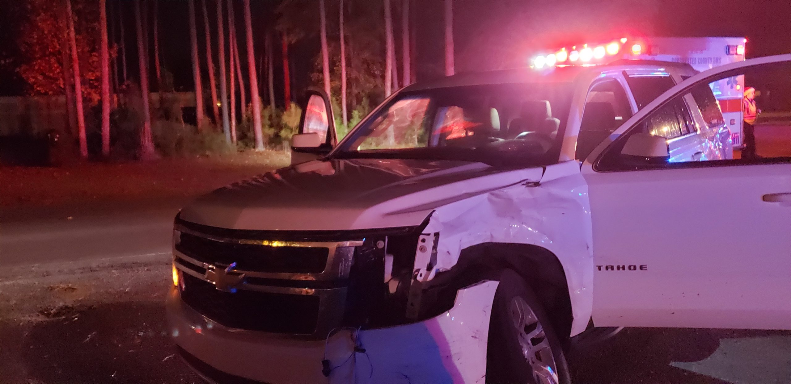 Chevy Tahoe with a crunched in bumper after being hit by a drunk driver